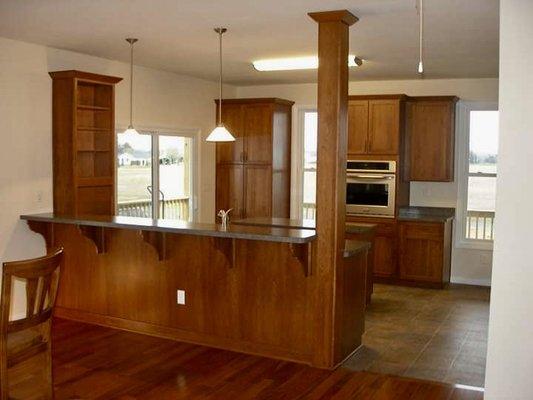 Lovely kitchen with bar into dining area.
