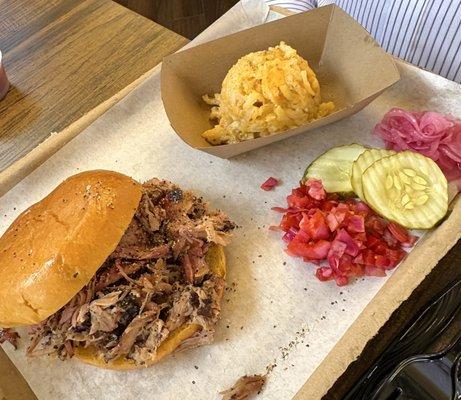 Pulled pork sandwich with cheesy potatoes