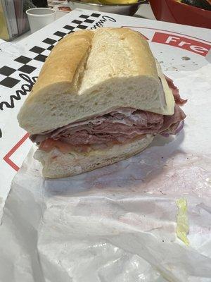 Very solid rare roast beef sandwich on a hero.