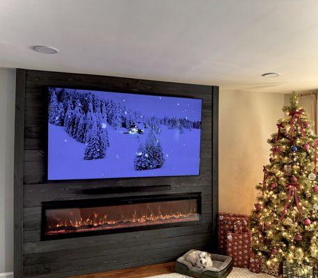 Entertainment wall unit with insert fireplace and soundbar