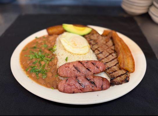 Bandeja Paisa-Steak, chicharron, linguica, beans, egg, rice and avocado.