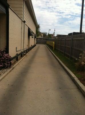 Driveway leading to limited & tight parking. The street works fine for large cars.