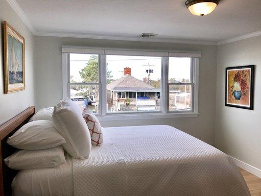 The beautiful Master bedroom inside the "Chatham-inspired" Suite overlooking the heart of Humarock and Humarock Beach 100 yards away.