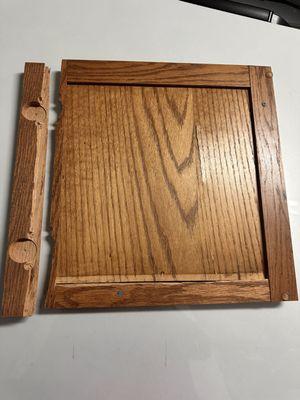 Broken bathroom cabinet door.