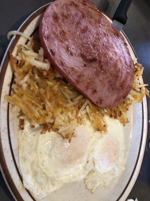 Eggs, ham, has browns and toast