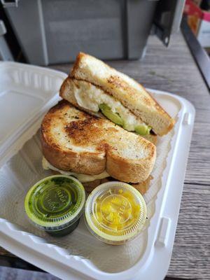 Avocado Melt comes with a few condiments