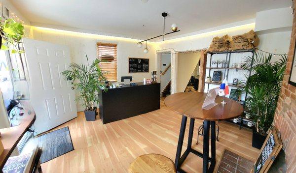 The 1st floor customer area. The stairs at the back corner lead to the 2nd floor seating areas and bathroom.