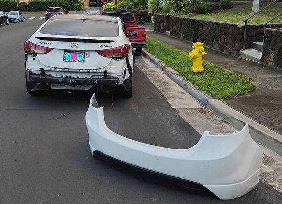 Rear bumper detached along with the electrical wiring for the reverse sensors.