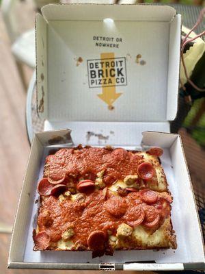 Meat Lovers Pizza from Detroit Brick Pizza Co. (pepperoni, sausage, bacon, cheese, red sauce on a fluffy crust)