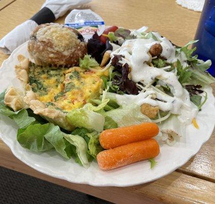 Quiche with salad and muffin.