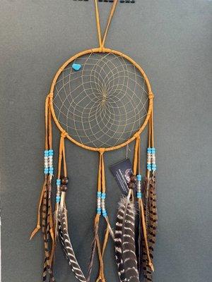 This is called "Natural Day" made with white tail USA Deer leather, turkey tail feathers and pheasant feathers