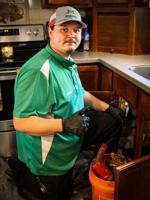 Jaden cleaning Kitchen drain sink back up !