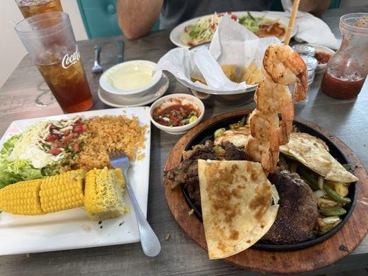 Charro Trio - skewer of shrimp, chicken and steak. The sides were pick, corn and salad. So yummy!