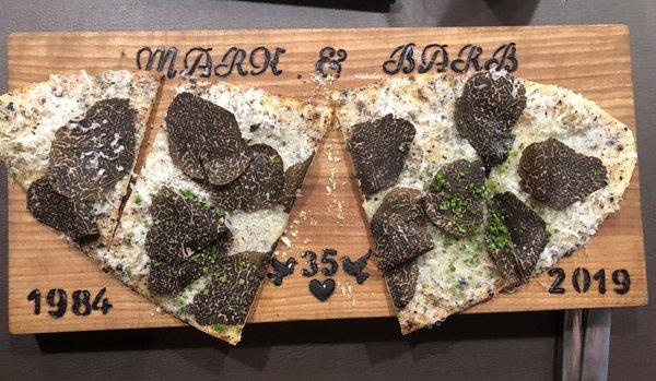 Black truffle thin bread on Izzy's etched wooden board
