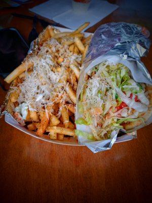 These are the BEST roasted garlic Parmesan fries along side the marinated chicken ceaser gyro! = Love