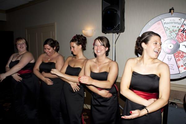 Bridesmaids doing the Macarena during the Wedding Wheel