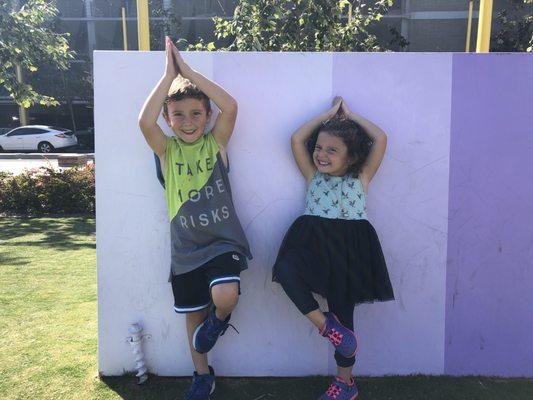 My kids striking a tree pose (balance pose) after class