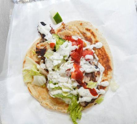 Fish gyro with salad white hot and barbecue sauce choices