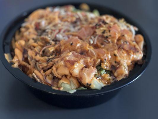 Poke Bowl: 1/2 rice 1/2 lettuce; crab meat and spicy salmon; corn, edamame, seaweed, cucumber, dried onion, spicy mayo, and eel sauce