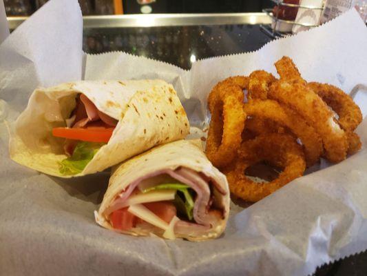 Club Wrap with a side of onion rings.