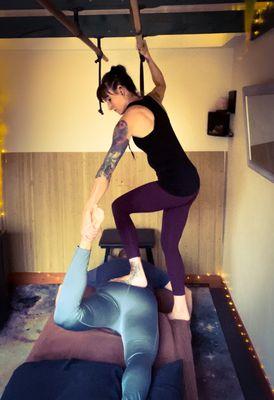 Stretch out during an Ashi-Thai massage