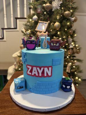 Cake I received MINUS the 4pc blox fruits toppings I bought myself and provided and candle I had to purchase because the original was paper