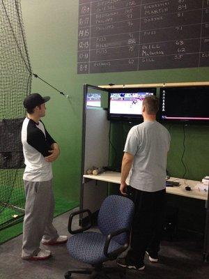 Owner and Lead Instructor, Jason Shelly, using video analysis to assist a player with his development.