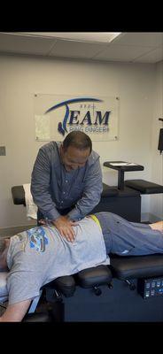 Dr. Vince giving a chiropractic adjustment