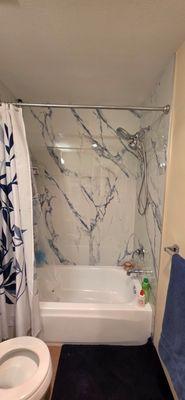 New tile installation and tub refinishing.