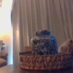 Ginger jar in rattan basket for coffee table for farmhouse or french country style