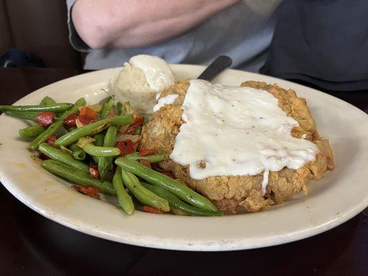 Chicken fried steak with green beans and mashed potatoes