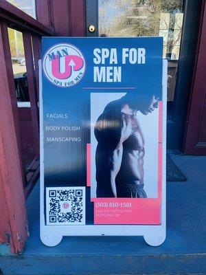 Man Up poster board with QR code
