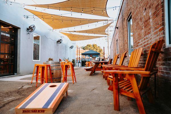 Outdoor seating and corn hole. Food Trucks! Dog friendly dining!