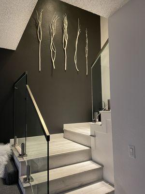 Glass stair railing.