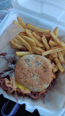 Corned beef sandwich and fries with house seasoning