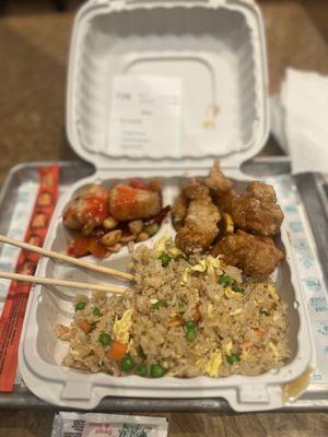 My sparse kung pao chicken on the left and my giant bread flavored orange chicken. The fried rice was the only redemption.
