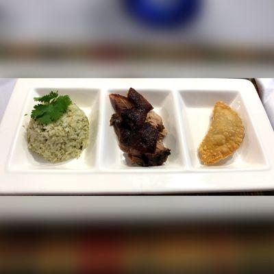 Cilantro rice, roasted pork, chicken empanada