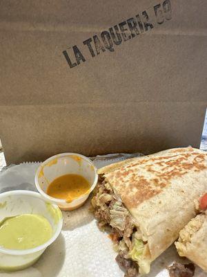 Classic Asada Burrito with super delicious green & orange sauce!