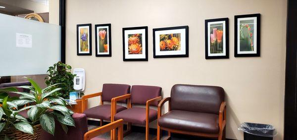 The waiting room with beautiful flower photos.