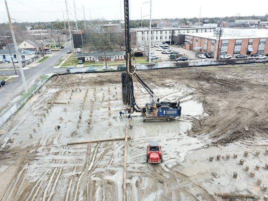 Aerial view of Osborne Contractors driving piles for a new foundation project.