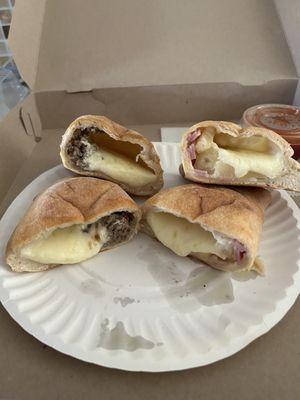 Two calzones, each cut in half. Note each is $16! There's more beef in a TB taco (and we all know how little that is).