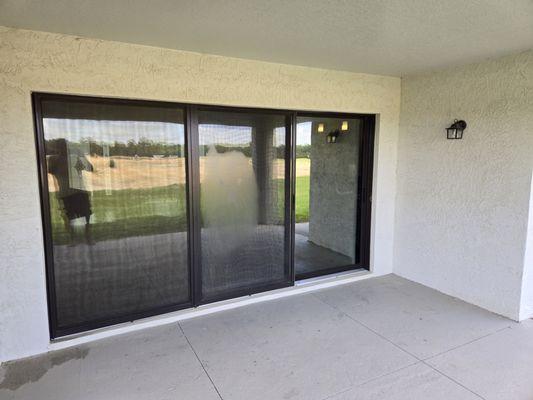 Sliding Glass doors with privacy film. Now they have privacy from the construction happening behind their home.