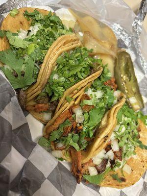 2 carne asada tacos & 2 Al pastor. delicious