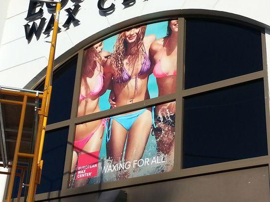 Perforated window vinyl for store fronts.