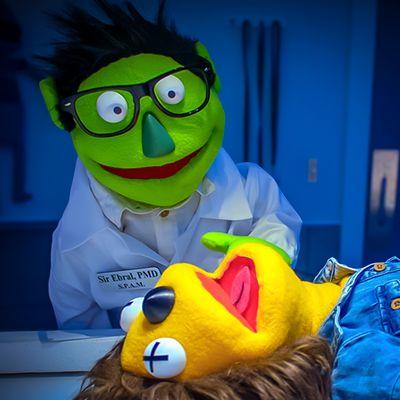 Sir Ebral doing a puppet autopsy. If you visit Appleseed Avenue, you might need to do one as well...