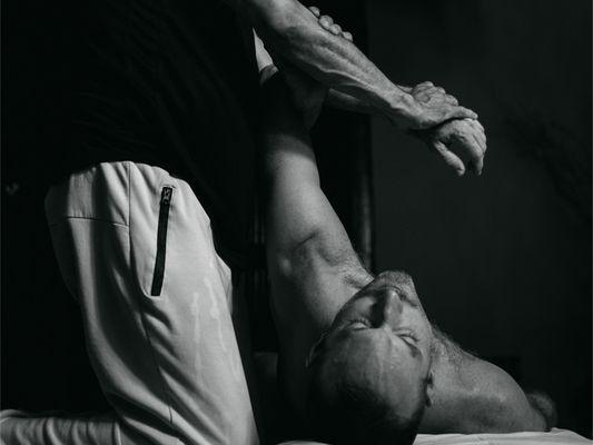 Sports. Stretching shoulder girdle, and decompressing elbow