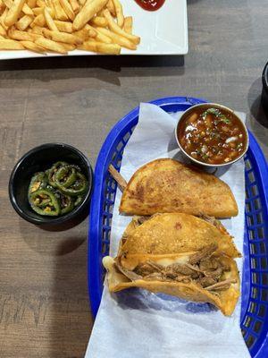 Birria Tacos with side of grilled jalapeños