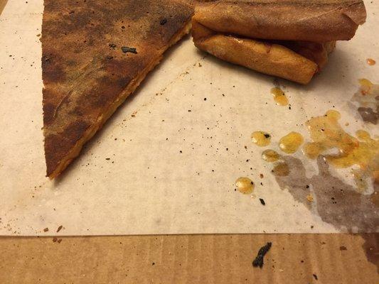 black charcoal-like pieces stuck on the back of the slices that i didn't really like