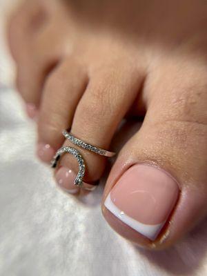 Smart gel pedicure with french tip.