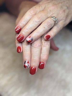 Bold and elegant with these red floral nails at Q Spa Nails!